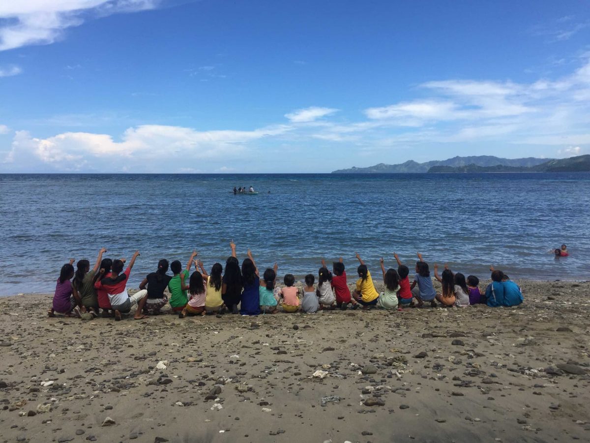 Children on beach outing in Philippines