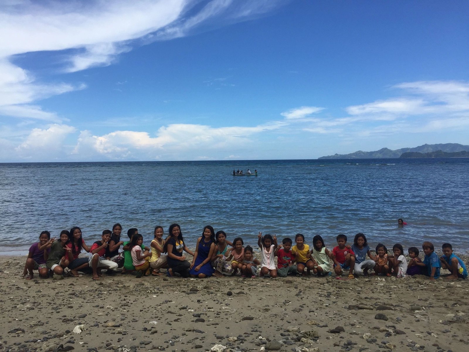 Youth gathering at beach in Philippine village